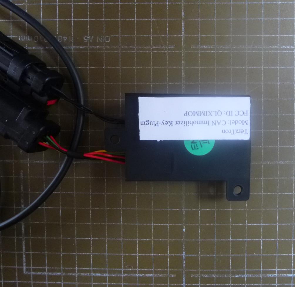 FCC ID QLXIMMOP ID Label Location Info
